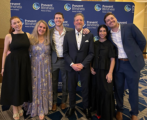 Howard Family- 2025 Prevent Blindness Person of Vision Honoree, Dr. Howard Purcell (center), New England College of Medicine, and family, attend the Prevent Blindness Person of Vision gala at Vision Expo East.