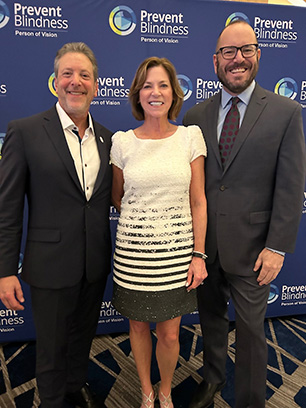 Howard Maureen Jeff- 2025 Prevent Blindness Person of Vision Honoree, Dr. Howard Purcell, New England College of Medicine, Prevent Blindness Person of Vision Committee Chair Maureen Cavanaugh, and Prevent Blindness President and CEO Jeff Todd, attend the Prevent Blindness Person of Vision gala at Vision Expo East.