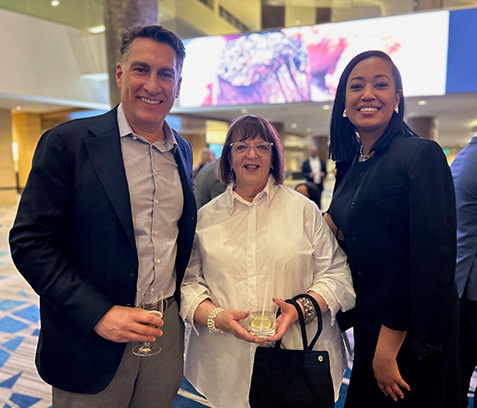 Marge Axelrad, (center) and guests, attend the Prevent Blindness Person of Vision gala at Vision Expo East.