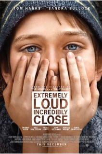 A movie poster for Extremely Loud and Incredibly Close. It features a child with wide eyes covering his mouth