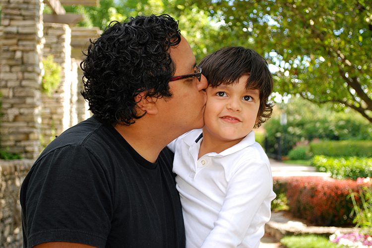 bigstock-Hispanic-father-kissing-his-ad-8203140