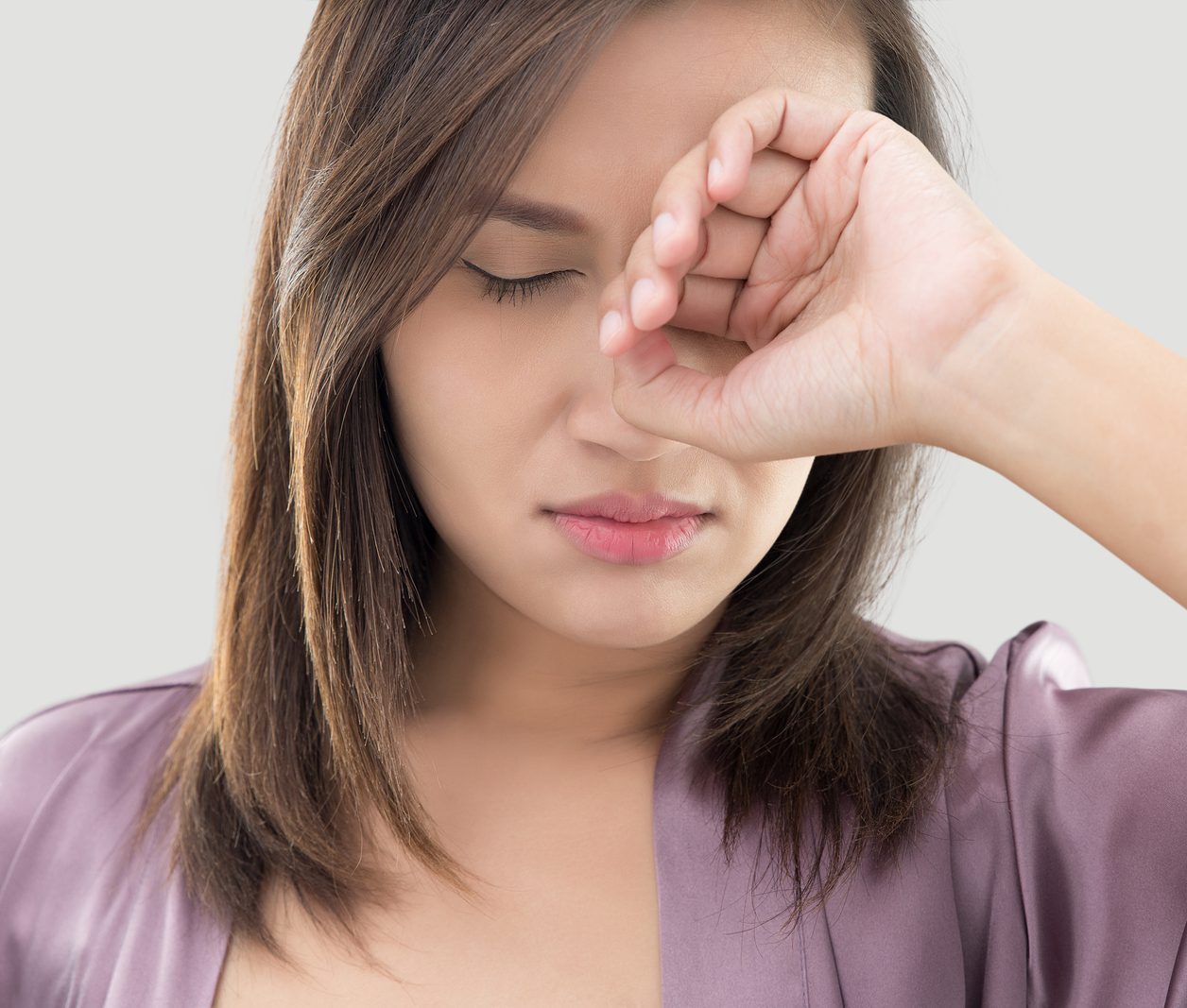 a woman experiencing dry eye symptoms