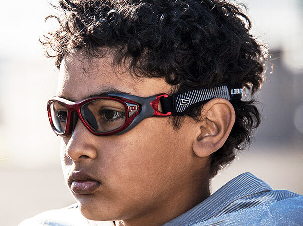 a child athlete wearing sports safety eyewear