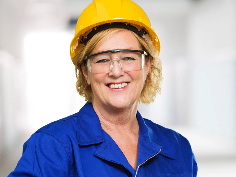 a woman wearing protective eyewear in the workplace