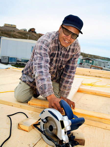 a man wearing protective eyewear while woodworking