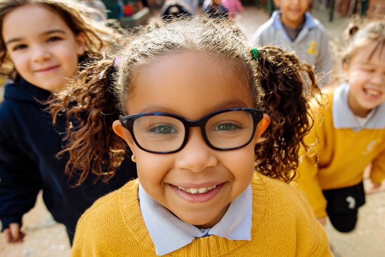 a child at school wearing glasses
