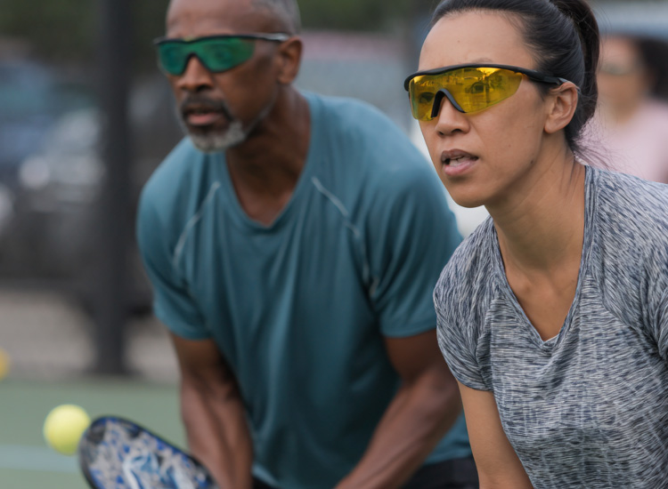 a couple playing pickle ball
