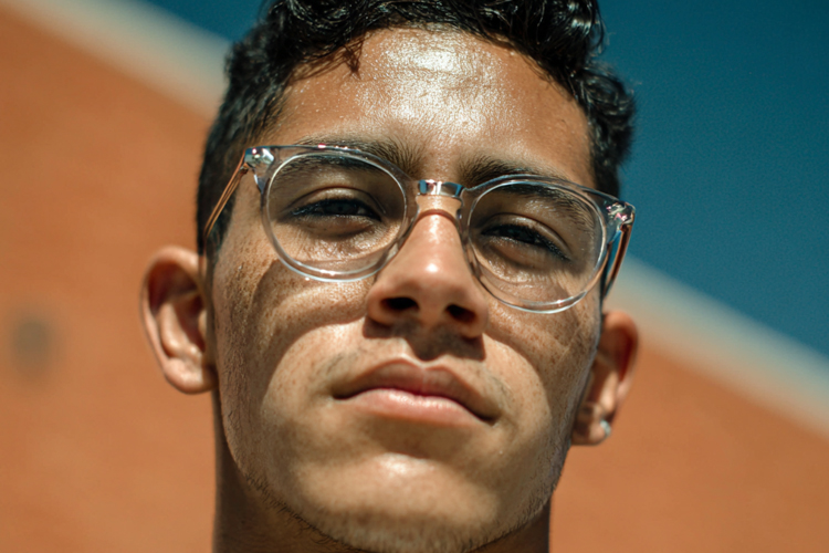 a young man wearing glasses