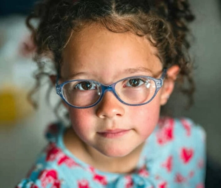 a preschool child wearng glasses