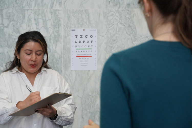 A volunteer with the Prevention of Blindness Society of Metropolitan Washington, D.C. conducts a vision screening. A volunteer with the Prevention of Blindness Society of Metropolitan Washington, D.C. conducts a vision screening.