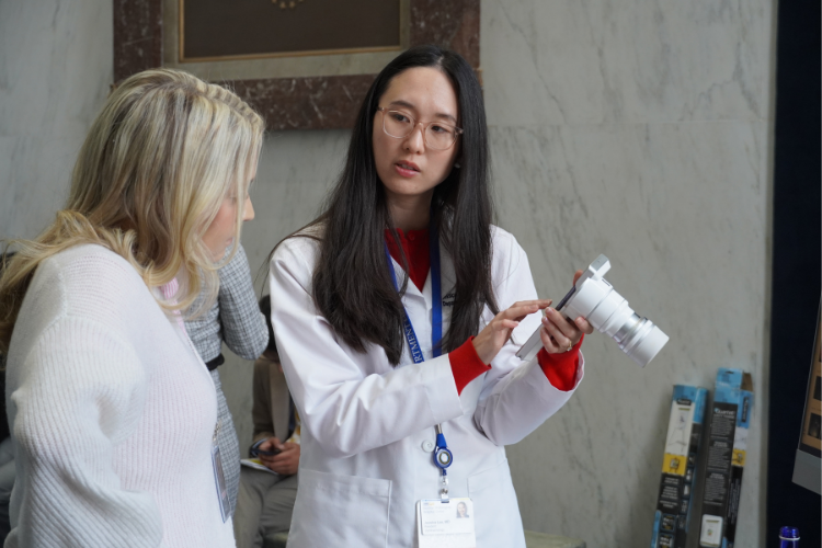 A volunteer with the Prevention of Blindness Society of Metropolitan Washington, D.C. shows the image from an eye scan. A volunteer with the Prevention of Blindness Society of Metropolitan Washington, D.C. shows the image from an eye scan.
