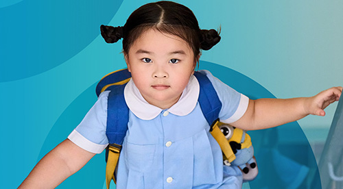 a school child wearing a school backpack